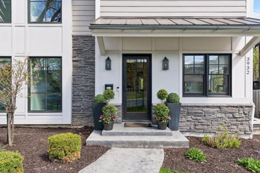 The concrete steps and sidewalk lead to your front entry and private elevator