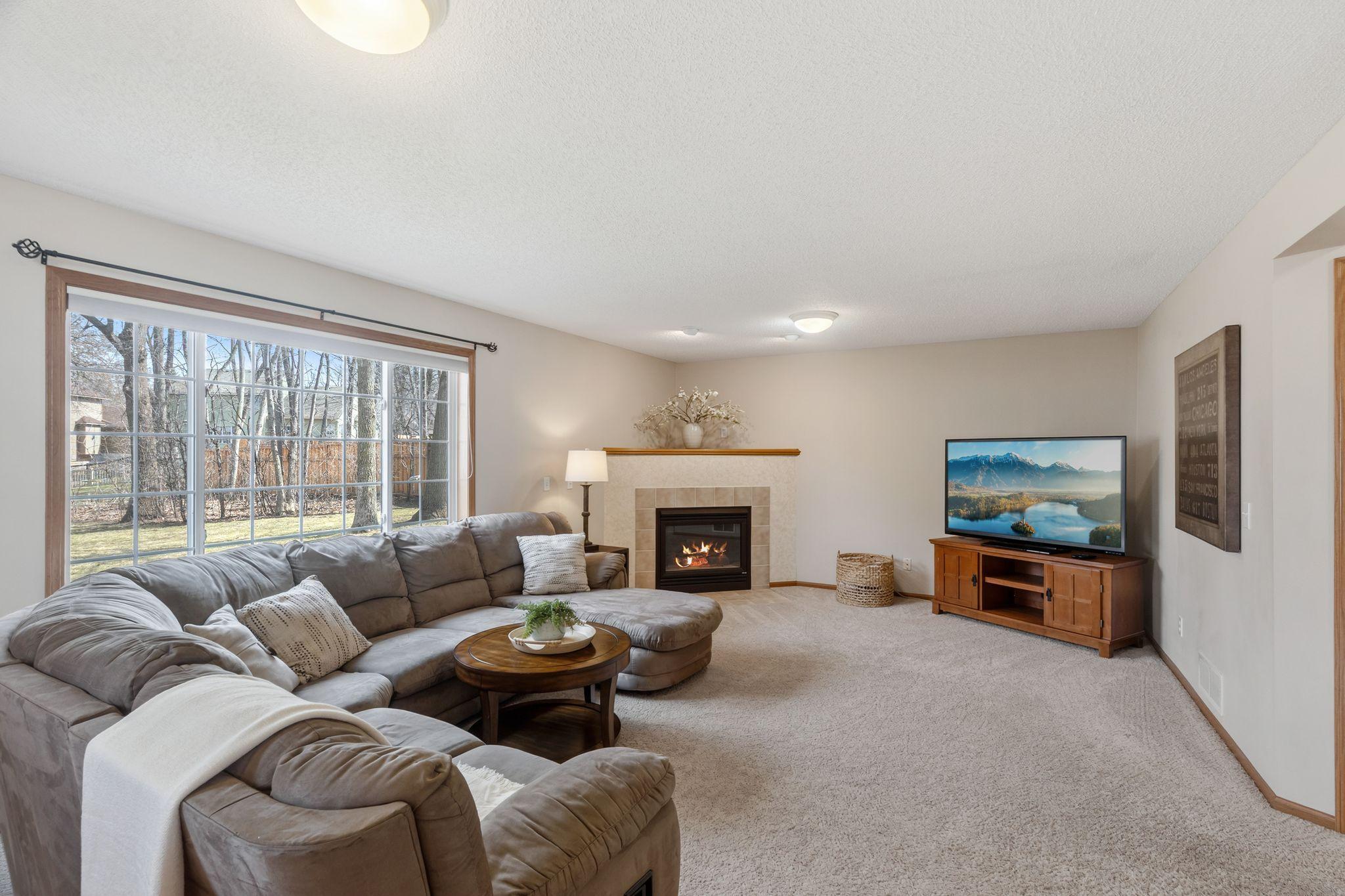 Spacious main level family room with gas fireplace