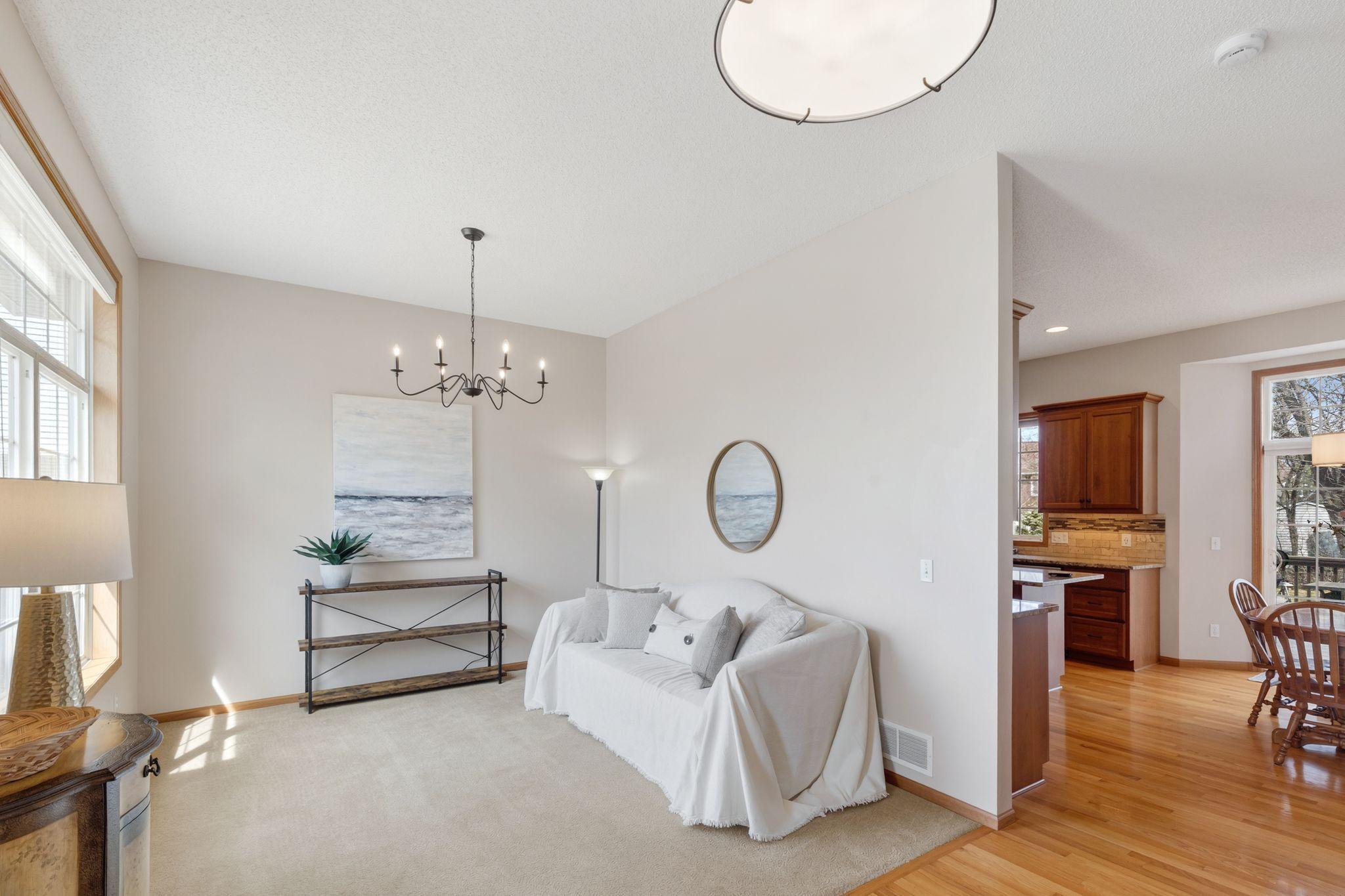 Welcoming front room is perfect for a sitting, conversation space