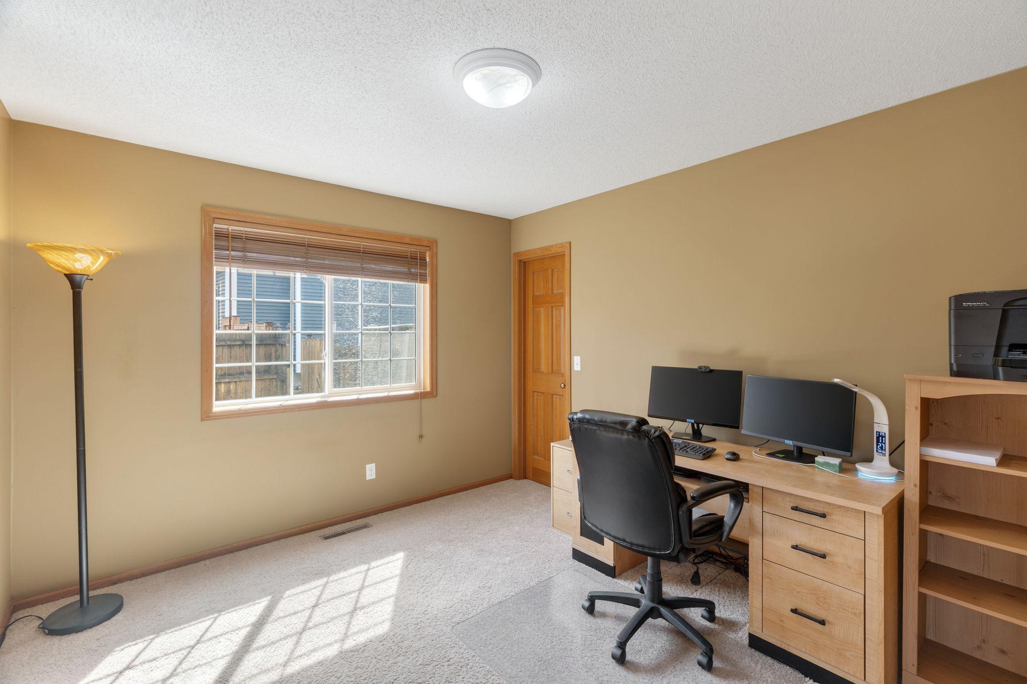 Main level flex room (bedroom or office) with French doors