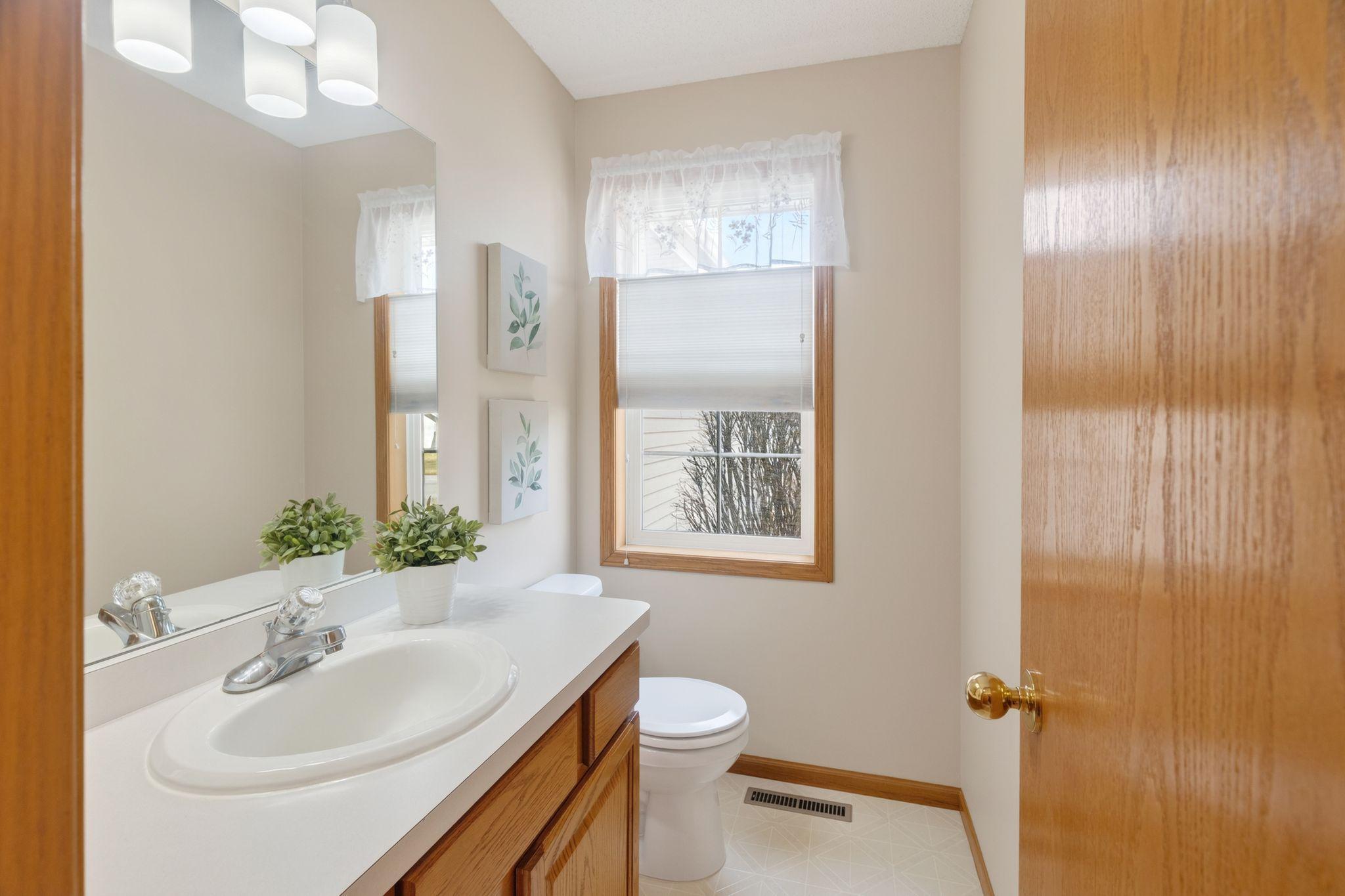 Main level 1/2 bath and convenient laundry