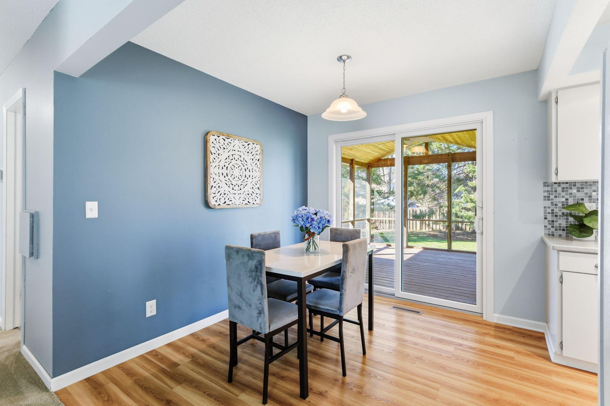 Dining Room Leads to the Vaulted Screened in Porch. Patio Door was Updated in 2020.