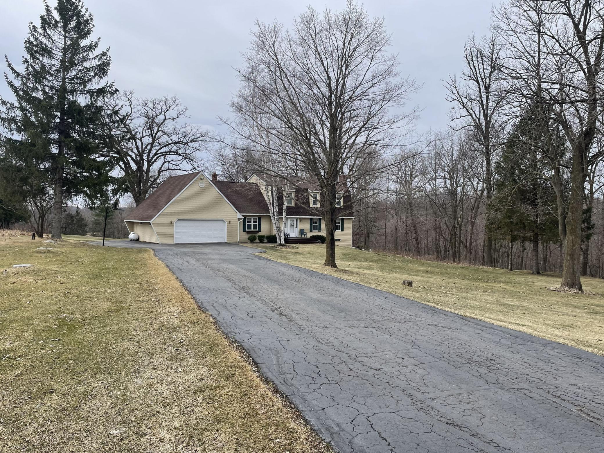 The oversized garage provides plenty of room for vehicles, storage, and all the extras that come with country living