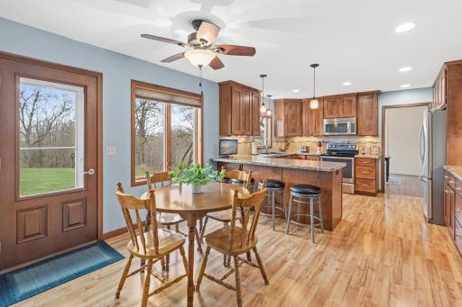 Dining nook connects seamlessly to the kitchen and outdoor access
