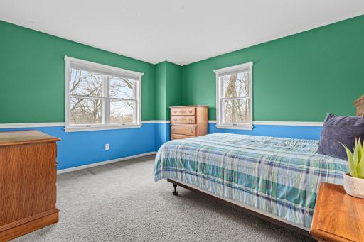 Bright upper-level 4th bedroom with space for guests, kids, or a home office