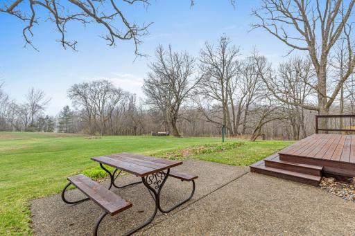 Patio and deck area create the perfect setting for outdoor dining and relaxing