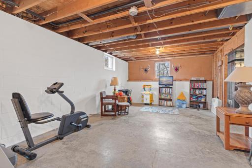 Unfinished lower level offers flexible space for hobbies, storage, or future equity