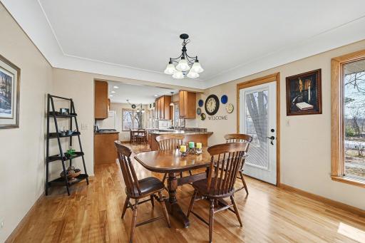 Gorgeous hardwood floors in dining and kitchen