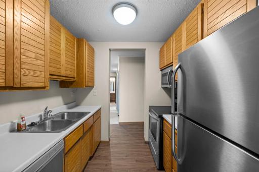 Enjoy a functional galley-style kitchen with plenty of counter space to make cooking and entertaining a breeze.