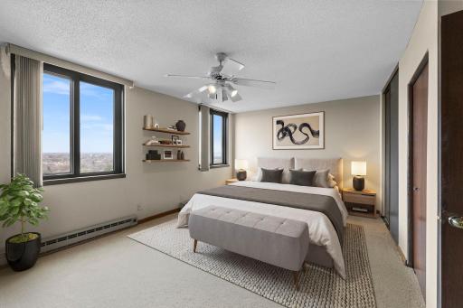 Spacious bedroom with lovely views and abundant natural light, creating an inviting and airy atmosphere
