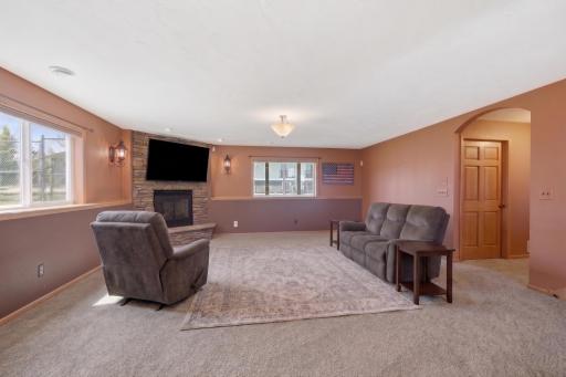Family Room with gas fireplace and sconce lighting.
