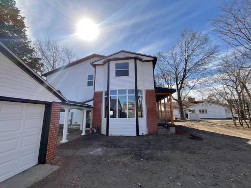 Bay window from the side of the home showing the breezeway walk way from garage to the side door