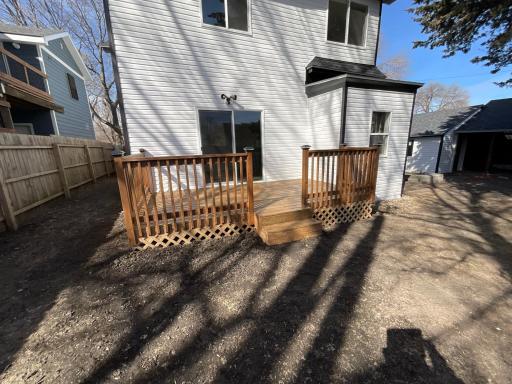 Back of house with brand new deck and sliding door from Dining room