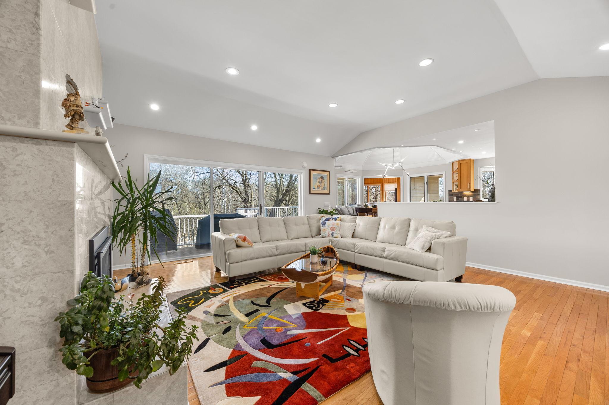 The living room with a glimpse of the kitchen.