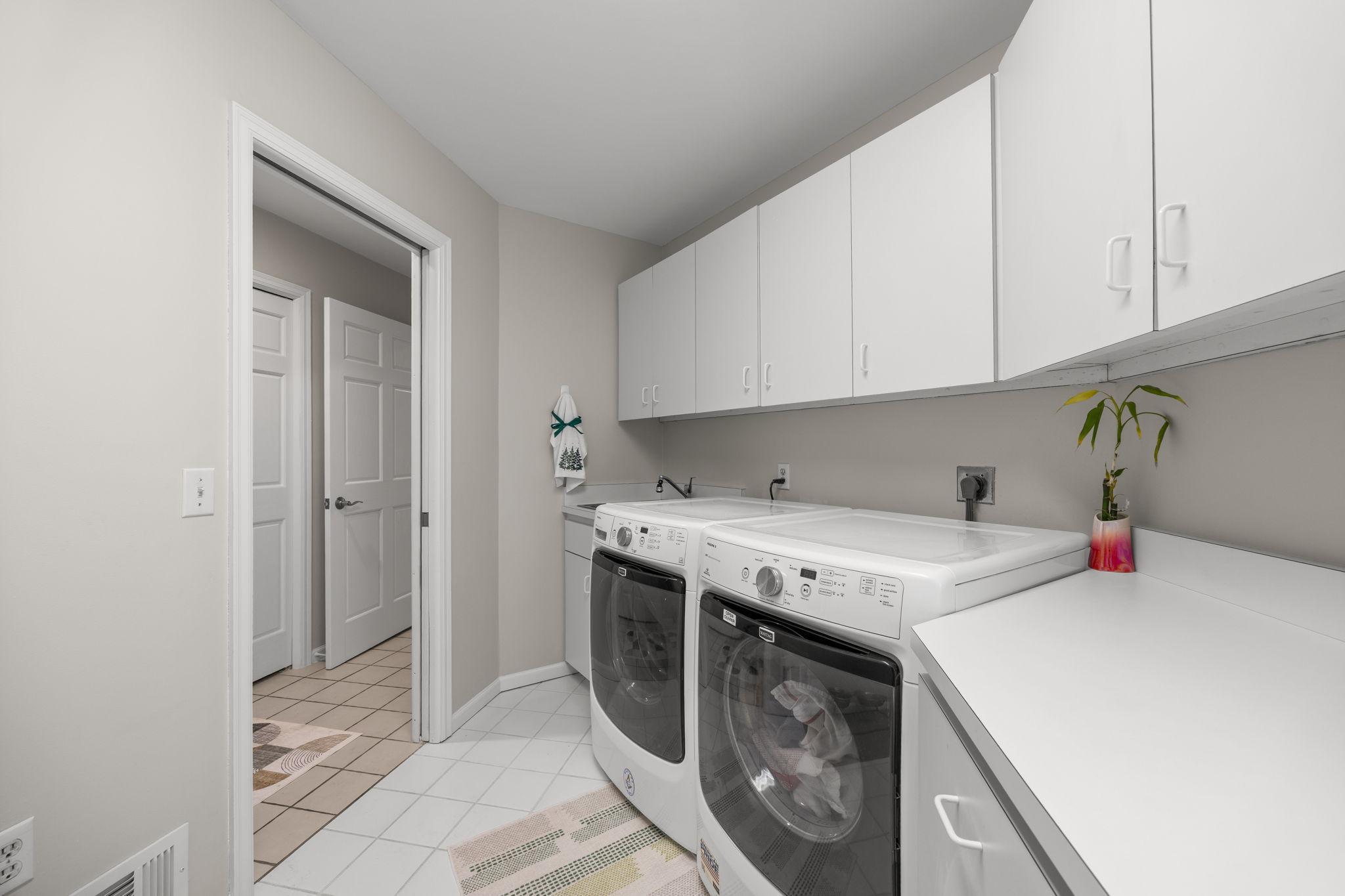 The spacious, bright and convenient laundry room...