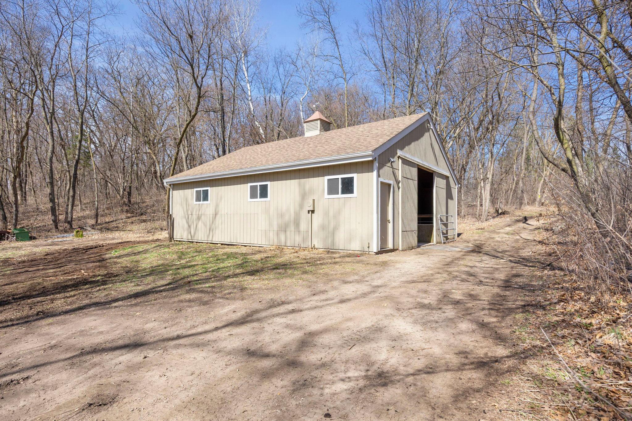 The pole barn with four horse stalls.