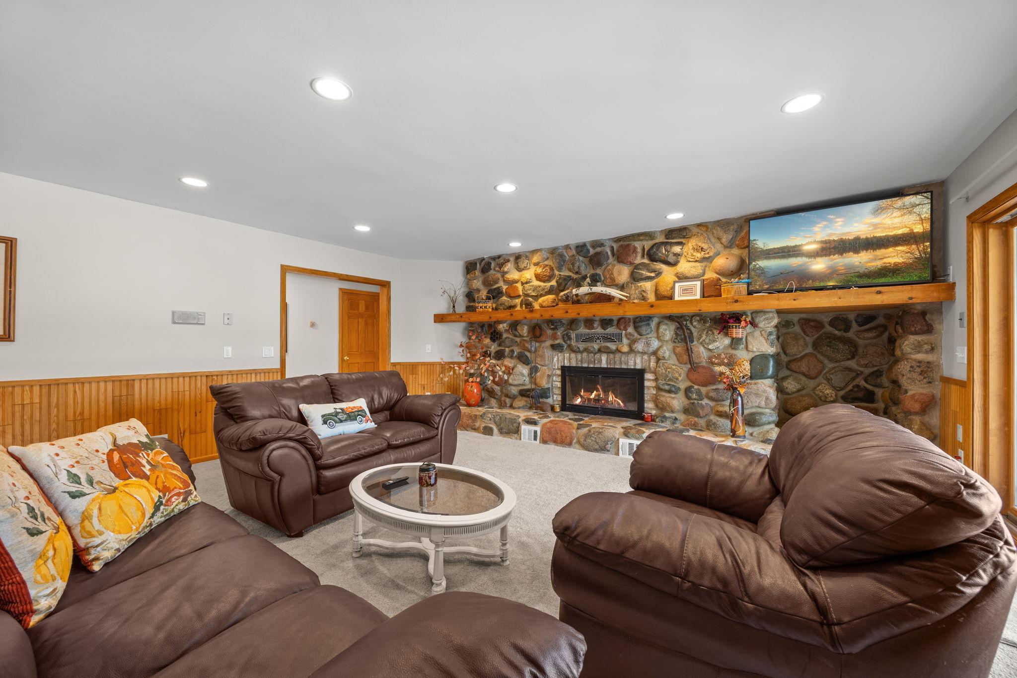 ...the family room with an incredible fireplace...