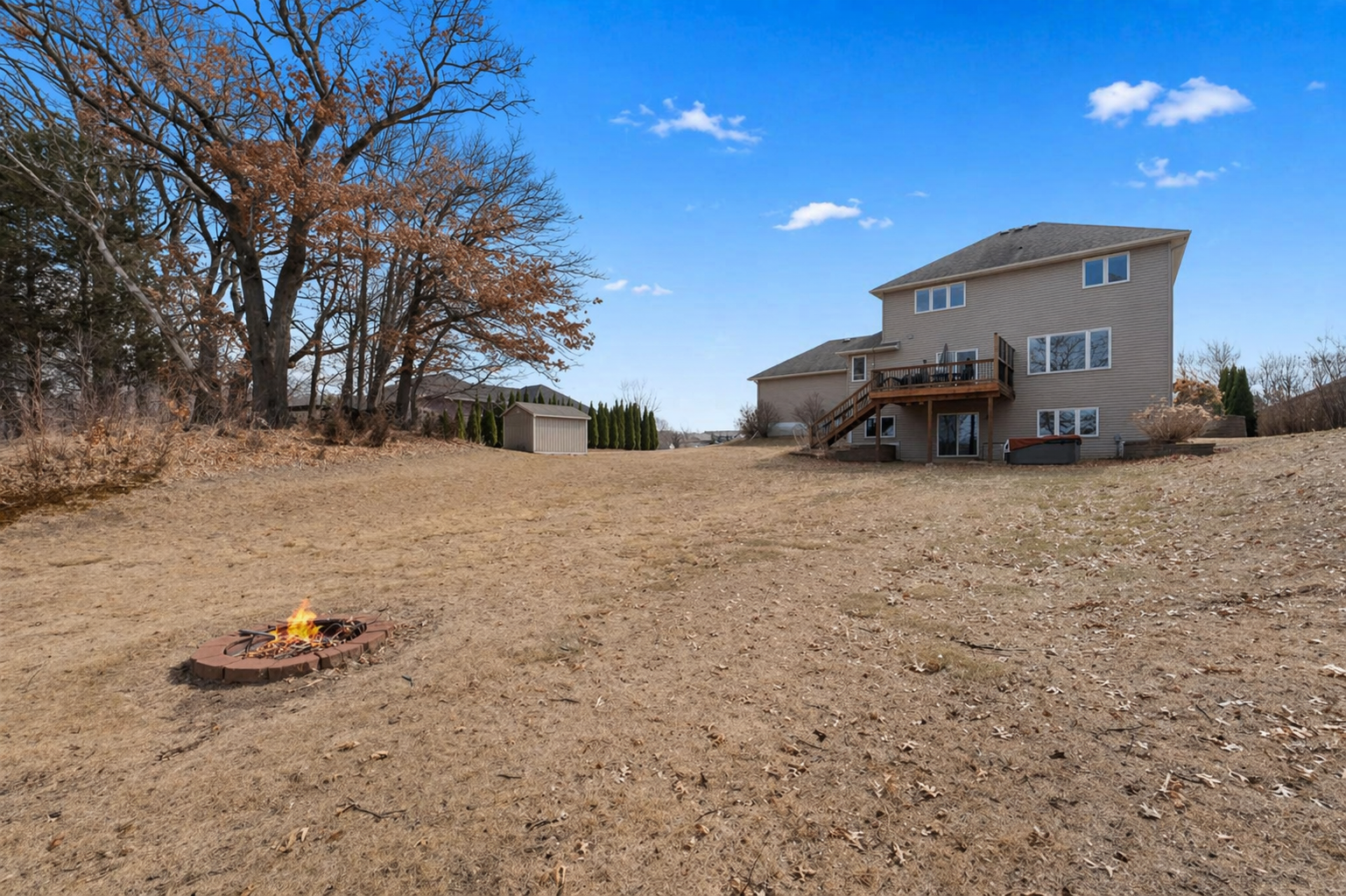 This property sits on 1.5 acres, so the backyard is a massive space to entertain in!