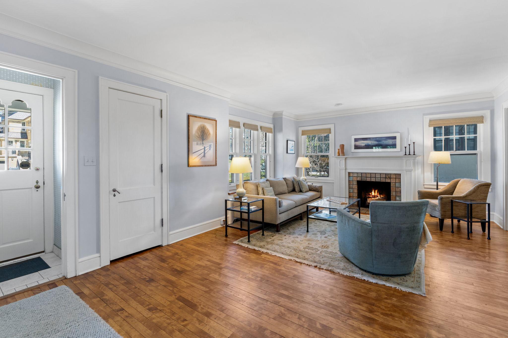Large living room with coat closet off of foyer