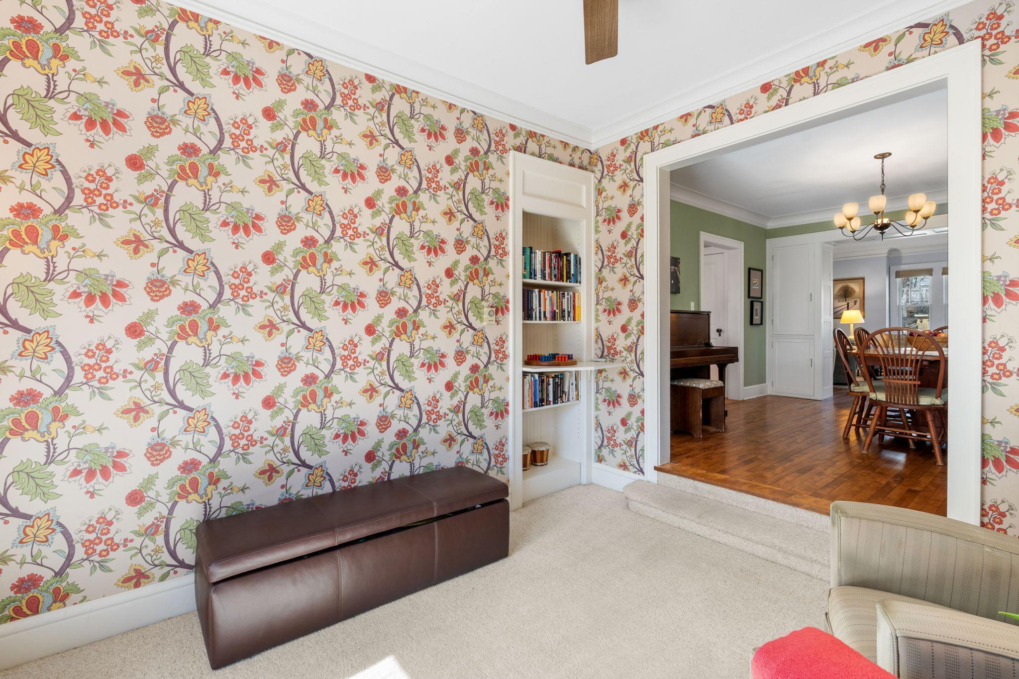 Elegant wallpaper, imported from England adds a touch of whimsy to this room