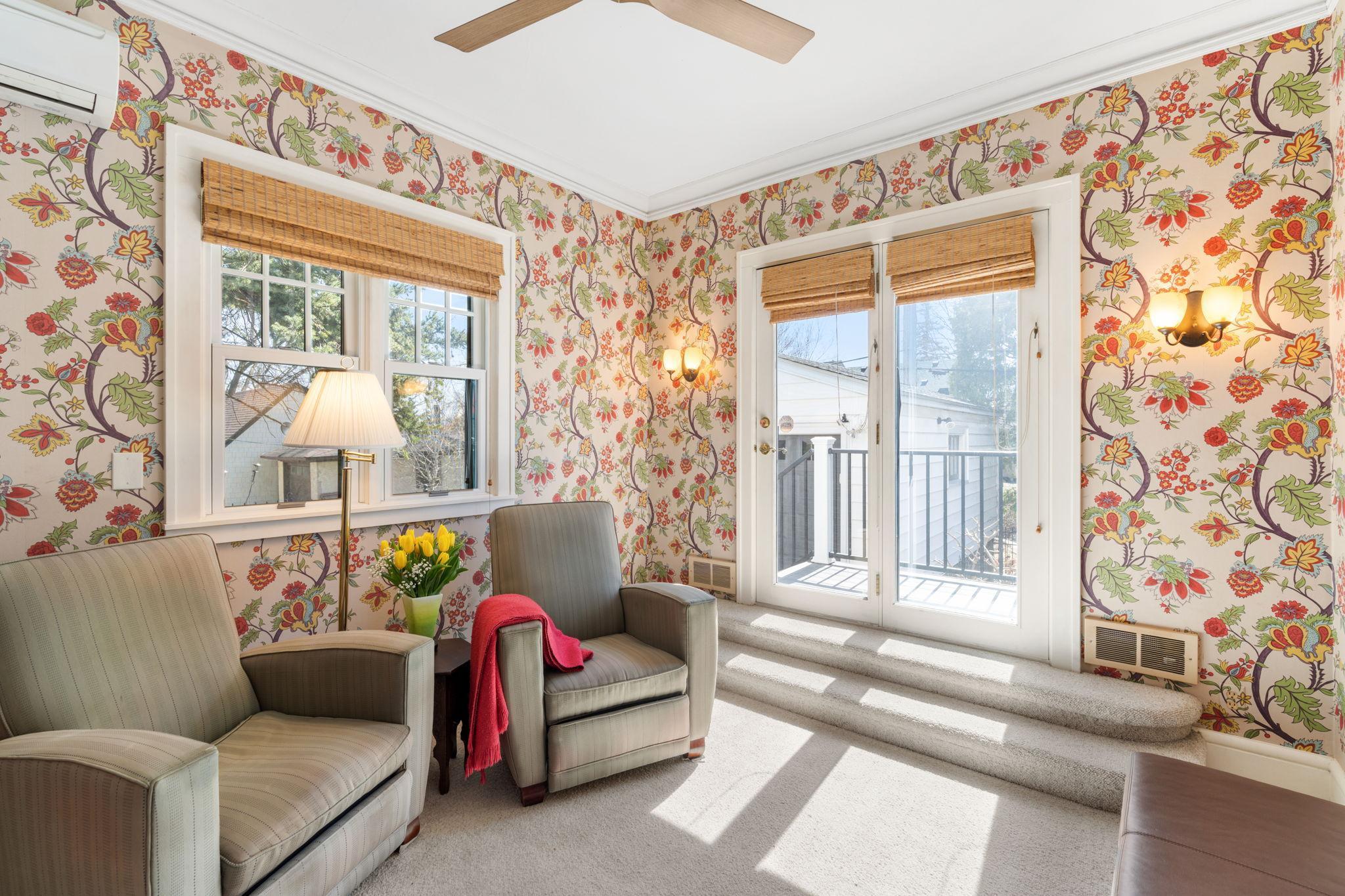 Another sunfilled room with access to the deck