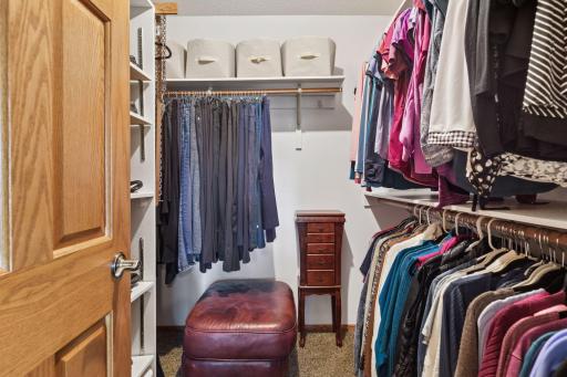 Spacious primary walk-in closet.