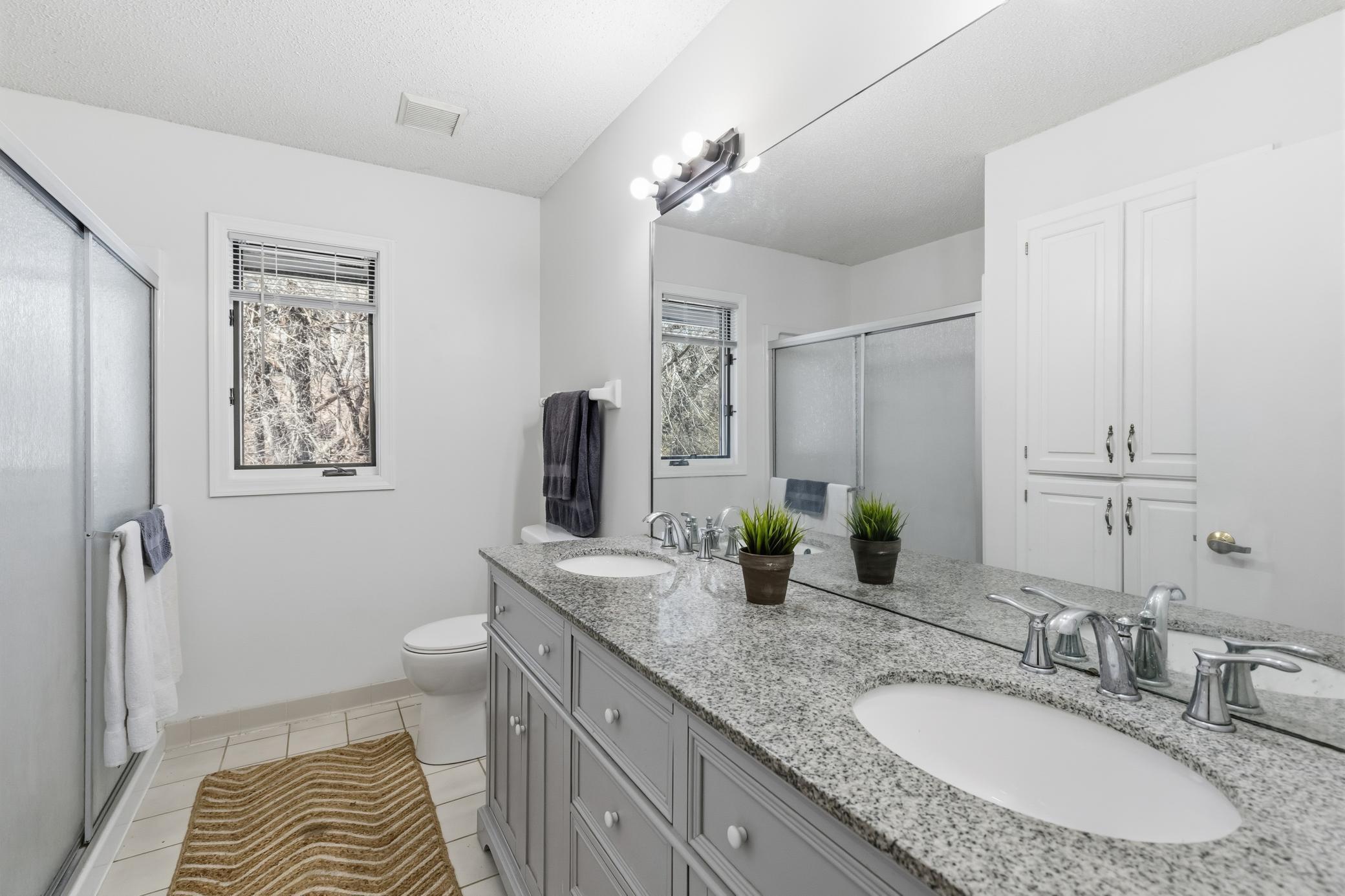 Upper level main bath - granite double vanity and so much storage!