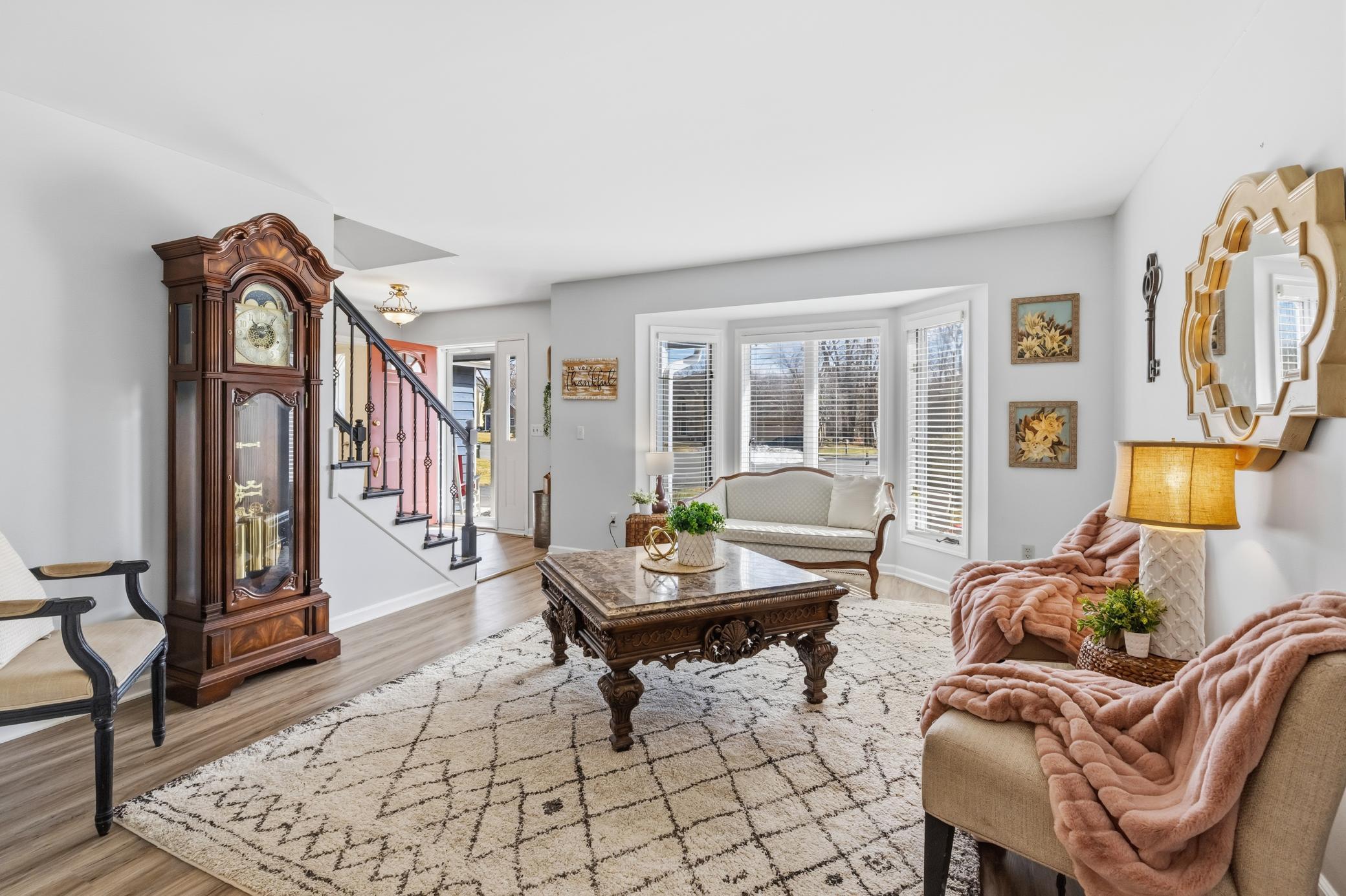 Large windows let in so much natural light. The sitting room greets you and is the perfect place for gathering.