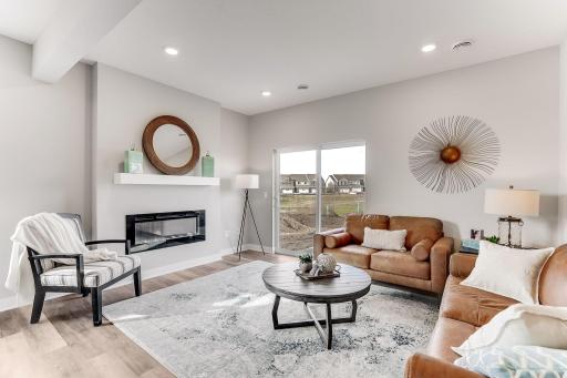 Living room centered by a fireplace