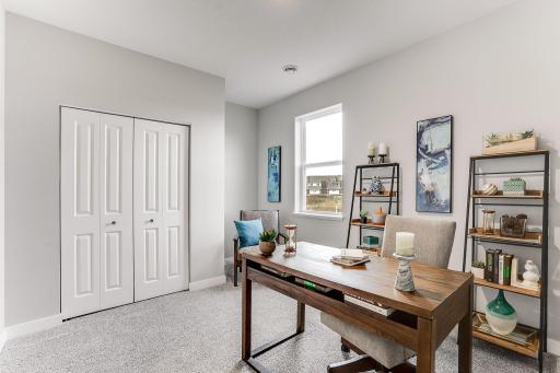 Main floor offers perfect personalization, including this flex room that could be utilized as an office or bedroom