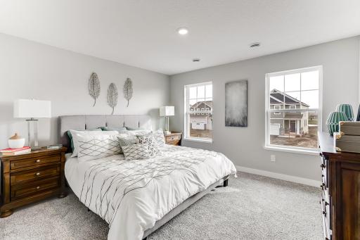 Primary suite that features two large walk-in closets