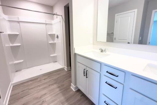 Primary suite completed with this dual vanity 3/4 bath