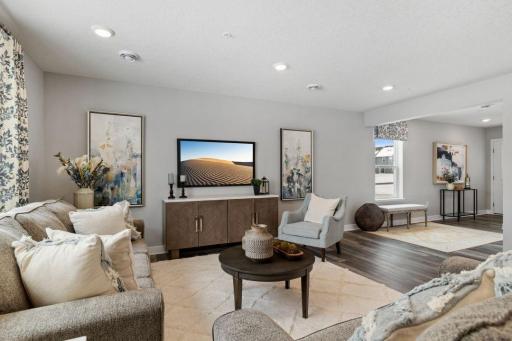 Spacious main level is light & bright with lots of windows and 9-foot knockdown ceilings. Photo is of model home. Colors and options may vary. Ask Sales Agent for details.