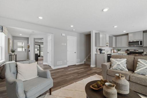 Open concept living. Our smart home package is included in every home. Photo is of model home. Colors and options may vary. Ask Sales Agent for details.