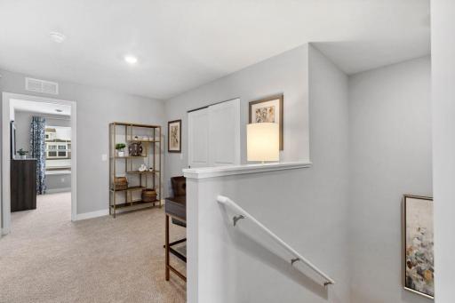 Upper-level loft lends itself to so many options - office, playroom, sitting area - you choose! Photo is of model home. Colors and options may vary. Ask Sales Agent for details.