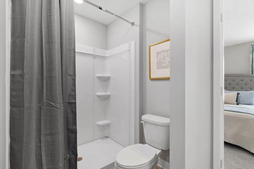 Steps away from the bedroom, the private ensuite with large walk-in shower. Photo of Model Home. Options and colors may vary. Ask Sales Agent for details.