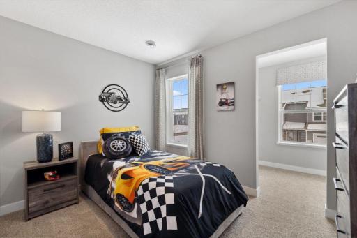 Each of the home's spacious secondary bedrooms feature well thought out window locations. Photo is of model home. Colors and options may vary. Ask Sales Agent for details.
