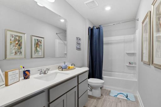 Upper-level hall bath offers a great solution for a busy family. Photo is of model home. Colors and options may vary. Ask Sales Agent for details.