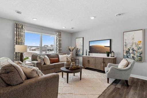 Another view of the wide-open main floor. Perfect for entertaining. Photo is of model home. Colors and options may vary. Ask Sales Agent for details.