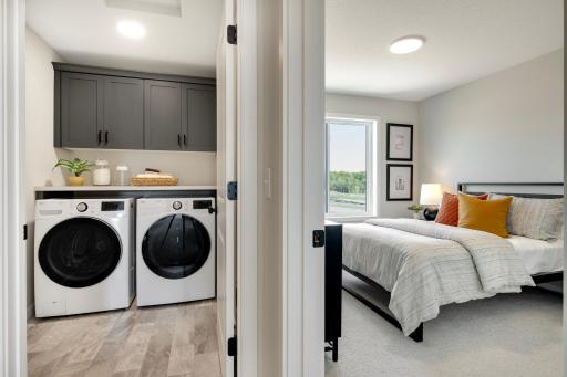 Conveniently located upstairs, this spacious laundry room offers both practicality and ease. Photos are from previously built home; options and features may vary.