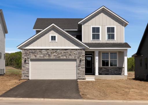 This charming home boasts stunning curb appeal, highlighted by beautiful LP Smartside exterior siding and elegant stone accents. Photo is of similar home. Options and upgrades will vary.