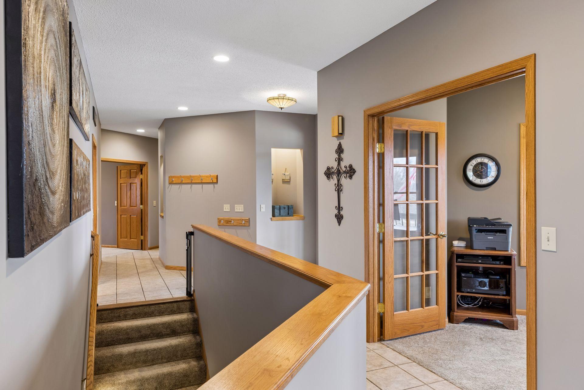 Main floor entry with unique art cubbies an architectural flair throughout with angular walls flowing room to room