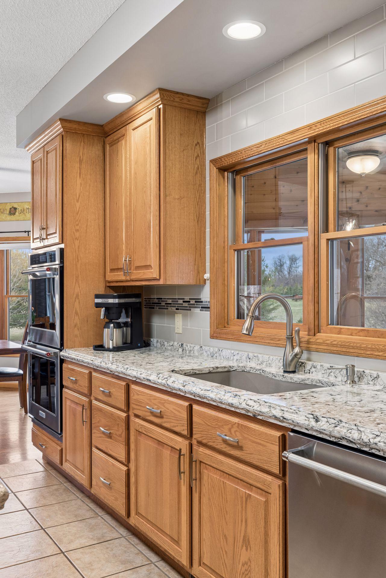 Kitchen overlooks expansive 3-season porch