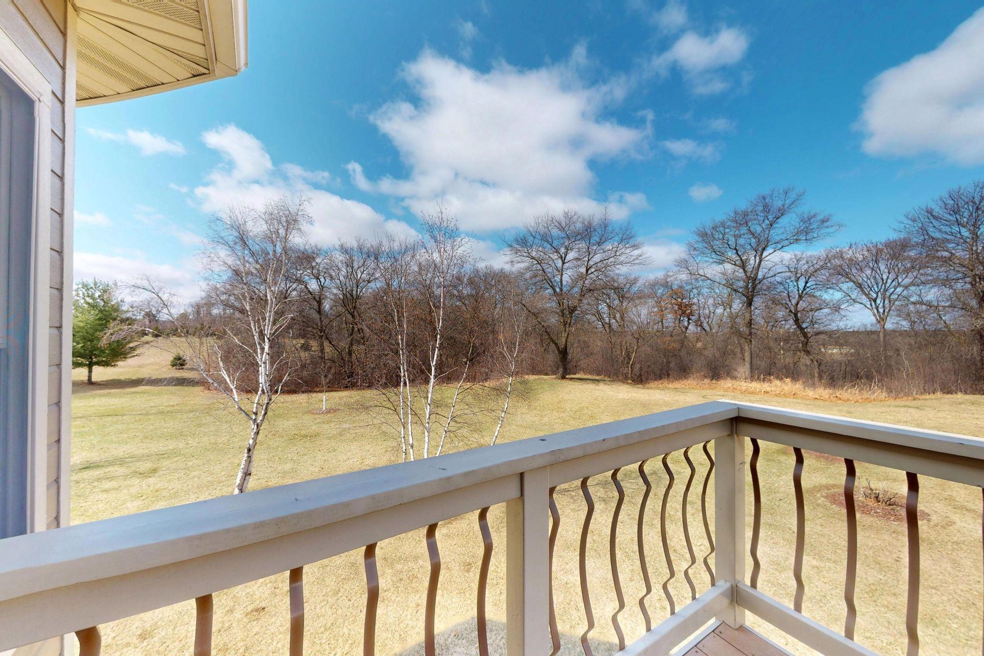 Deck with access just off the primary suite and 3-season porch