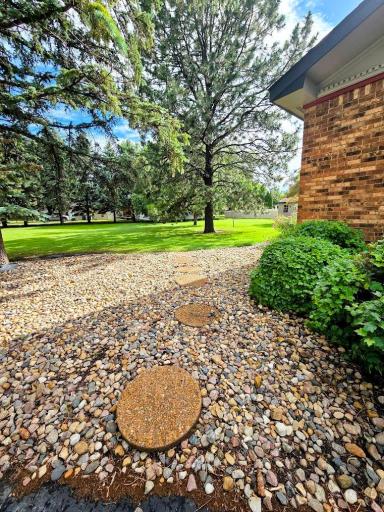 Landscaping rock and stepping stones to backyard.