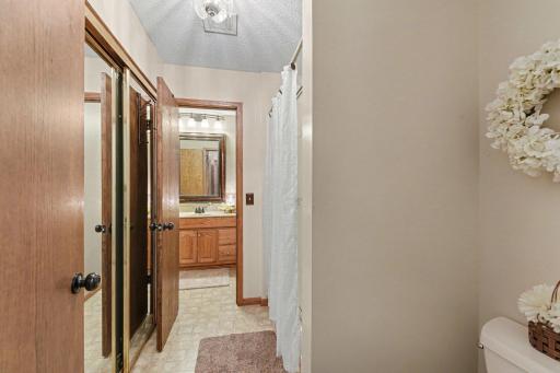 Guest bath has very spacious linen closet and tub/shower.