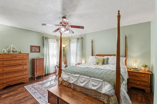 SW bedroom with window facing the backyard pool oasis. Lovely private mastersuite!