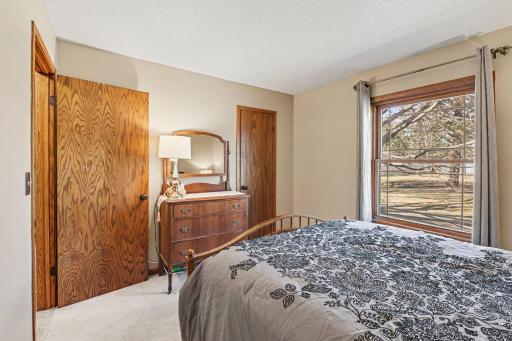 North bedroom is carpeted with walk in closet.