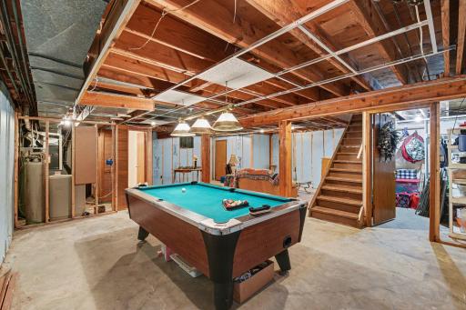 Poured concrete walls. Pool table and lights included. Sellers removed older dated paneling, so walls are ready for buyers to finish to their style!