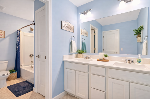 Main Bath with separate and private shower/toilet - virtually staged
